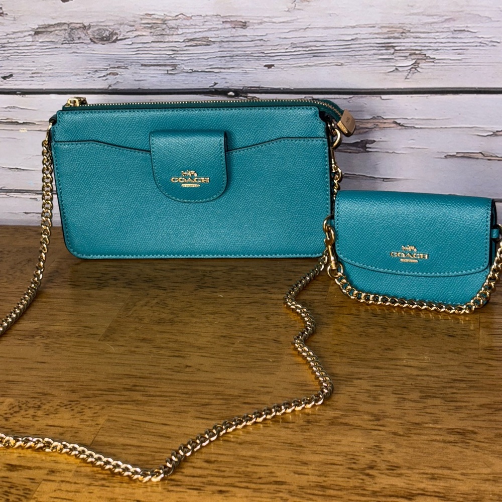 Coach poppy crossbody with detachable card case.